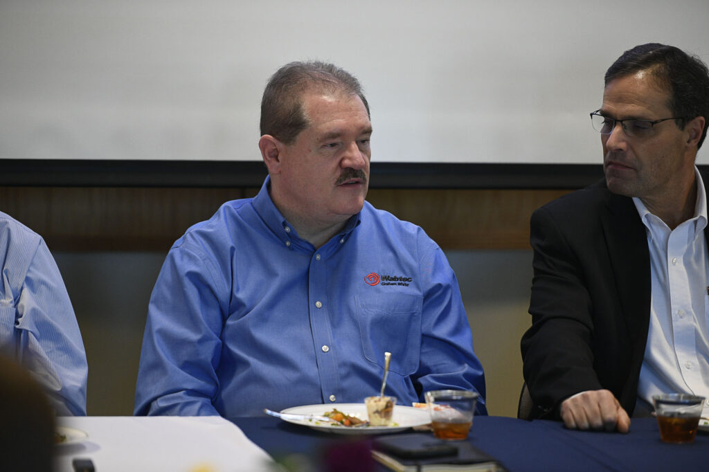 Doug Agner of Wabtec  speaks to a room of people during a panel discussion.