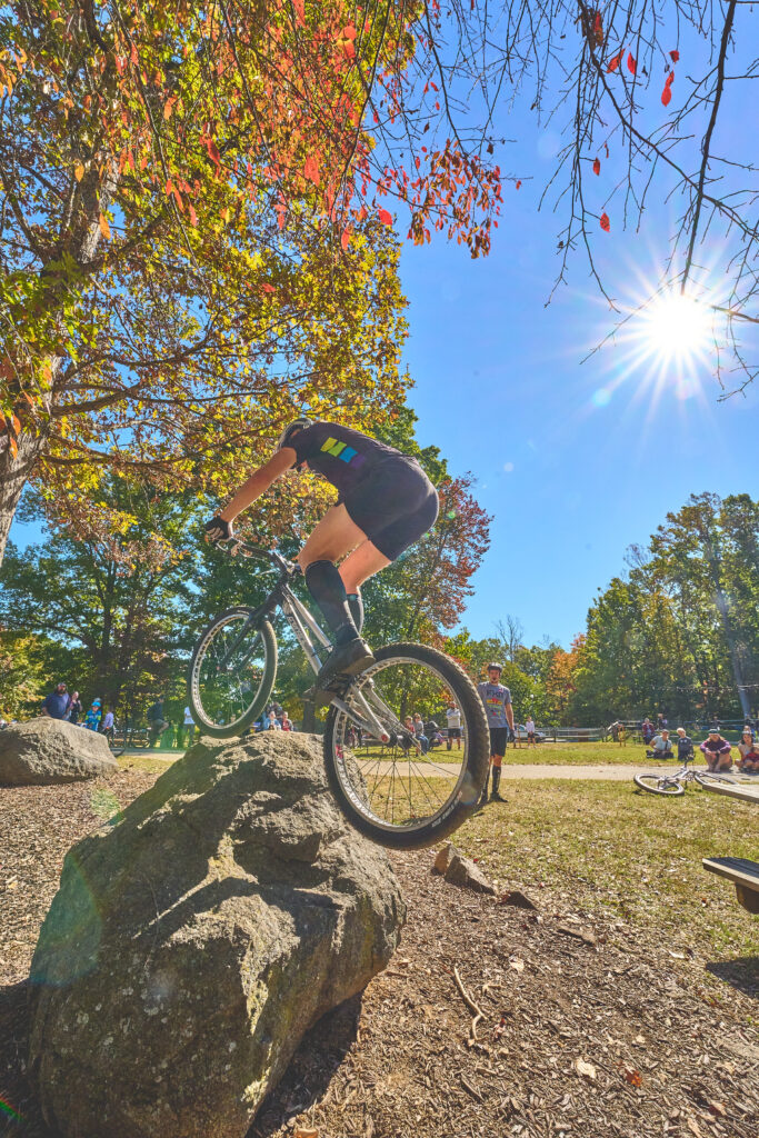 A cyclist does trick on some large rocks on a sunny fall day in Roanoke County for Roanoke GO Outside Festival.